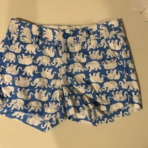 Lily Pulitzer blue background with white elephants.